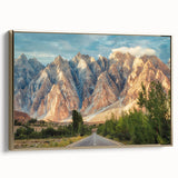 Framed canvas featuring a vintage-style landscape painting of a Pakistani scenery in muted gold and black tones.