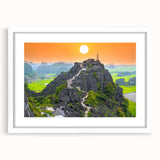 Abstract art print of a Vietnamese landscape in muted earth tones on a framed white mat, ideal for dining room decor.