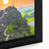 Extra large framed canvas depicting a textured, colorful Vietnamese landscape in black with vibrant touches.
