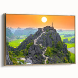 Framed canvas featuring a vintage-style landscape painting of a Vietnamese scenery in black and gold tones.