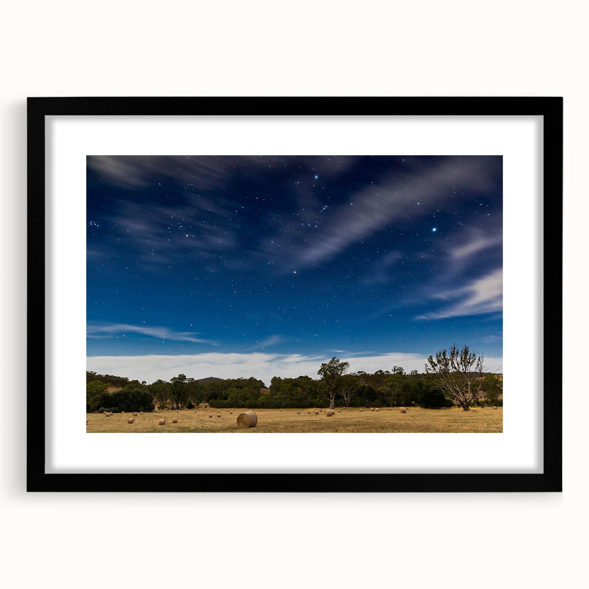 Abstract art print of Adelaide scenery in vibrant colors on a large textured canvas, framed in black.
