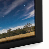 Black wall art featuring a textured depiction of Adelaide's skyline on a large framed canvas with colorful accents.