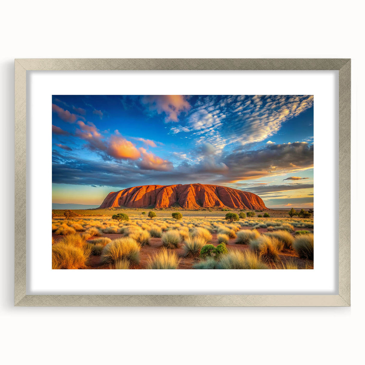 Abstract art print of Ayers Rock in muted orange and brown tones on a framed silver mat, suitable for dining room decor.