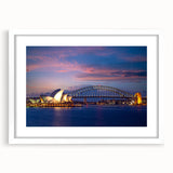 Abstract art print of Sydney skyline in muted blue and gray tones, framed with white mat, ideal for dining room decor.