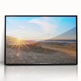 Large abstract wall art depicting vibrant multicolored geometric shapes on acrylic, framed in black.