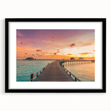 Extra large abstract art print of a colorful Caribbean scene on textured canvas, framed in black.