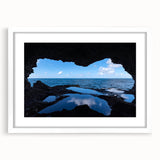 Textured abstract art print of a Caribbean seascape in muted blue and green tones, framed with a white mat.