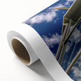 Art deco poster of Caribbean scenery on rolled canvas, featuring pastel blue and pink tones, ideal for nursery wall art.