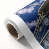 Art deco poster of Caribbean scenery on rolled canvas, featuring pastel blue and pink tones, ideal for nursery wall art.