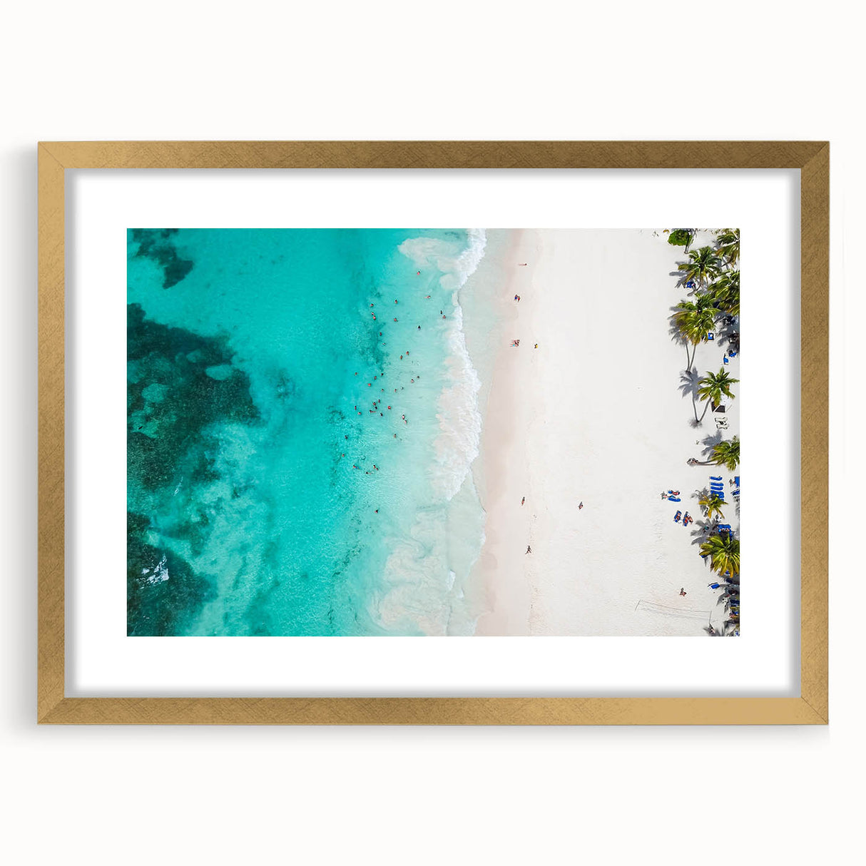 Abstract art print of Caribbean scenery in muted blue and green tones, framed in gold.