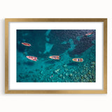 Abstract art print of Caribbean scenery in muted blue and green tones on a framed canvas, suitable for dining room decor.