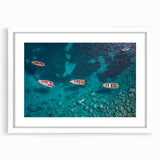 Textured abstract art print depicting Caribbean scenery in vibrant blues and greens on a framed white matte canvas.