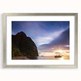 Textured abstract art print depicting the Caribbean scenery in muted blue and green tones, framed in silver.