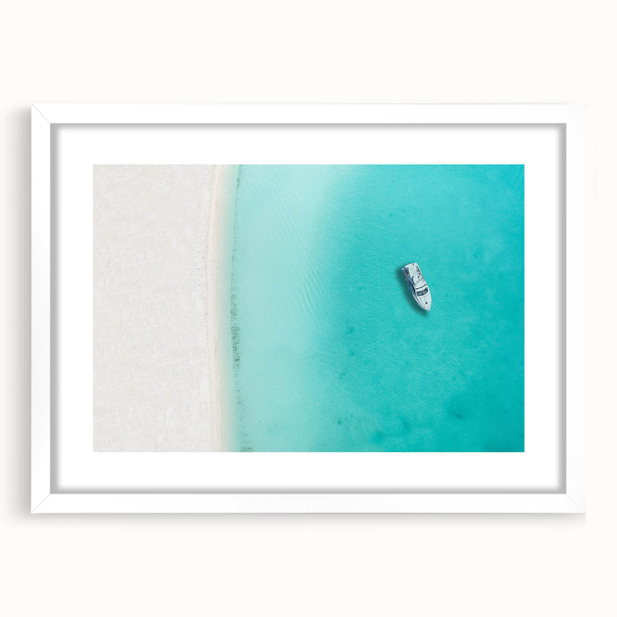 Textured abstract art print of Caribbean scenery in muted blue and green tones on a white-framed canvas.