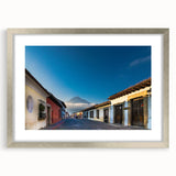 Textured abstract art print of Central American scenery in muted earth tones, framed in silver, ideal for bedroom art.