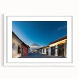 Abstract art print of a Central American landscape in muted earth tones on a white framed mat.