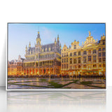 Mid-century modernist art depicting a serene European landscape in muted blues and greens, acrylic print framed in white.