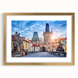Abstract art print of Prague skyline in gold frame, featuring muted earth tones, ideal for dining room decor.