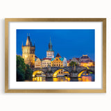 Abstract art print of a European cityscape in muted gray and gold tones on a framed canvas, suitable for dining room decor.