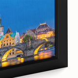 Close-up of black wall art featuring a textured Prague cityscape in vibrant colors on a framed canvas.