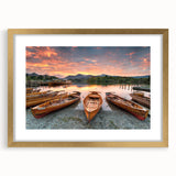 Abstract art print of Cumbria scenery in muted green and gold tones, framed with a gold mat.