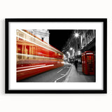 Colorful abstract art print of a textured London skyline in vibrant hues, framed in black, ideal for living room decor.