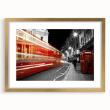 Abstract art print of London scenery in muted gold and black, framed with a gold mat.
