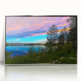 Large art print of a serene Finnish landscape in muted blues and greens, framed in silver acrylic.