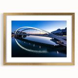 Abstract art print of Lyon with muted gold and white tones, framed with a gold mat, suitable for dining room decor.