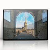 Large abstract wall art depicting the Normandy coast in muted gray and blue tones, presented in a black framed acrylic.