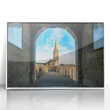 Mid-century modernist art depicting a serene Normandy landscape in muted green and blue tones, acrylic print framed in white.