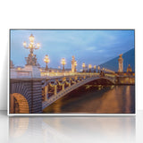 Mid-century modernist art depicting Paris scenery in muted blue and white tones on framed acrylic.