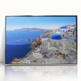 Framed acrylic print of Santorini scenery with white buildings and blue domes, ideal for modern art wall decor.