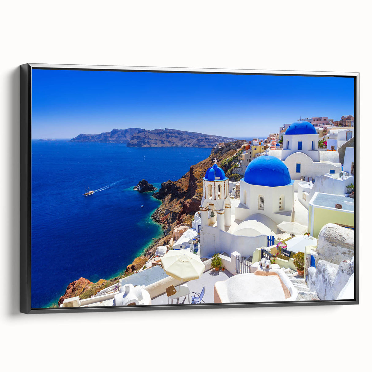 Framed canvas of a black and white vintage poster art depicting the Santorini landscape, ideal for bedroom wall decor.