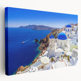 Large art print of Santorini landscape on stretched canvas, featuring blue and white tones, ideal for kitchen wall art.