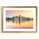 Abstract art print of a European scenery in muted earth tones, framed with a gold mat, suitable for dining room decor.