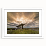 Textured art print depicting an abstract Irish landscape in muted green and blue tones, framed in white.