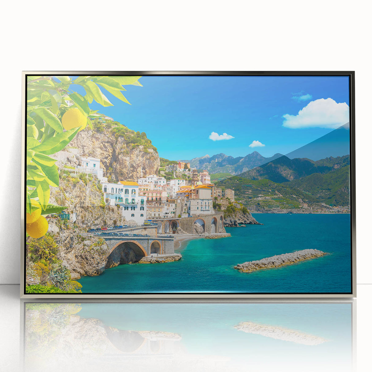 Mid-century modernist style acrylic print of Amalfi Coast with vibrant blue and pastel sky, framed in silver.