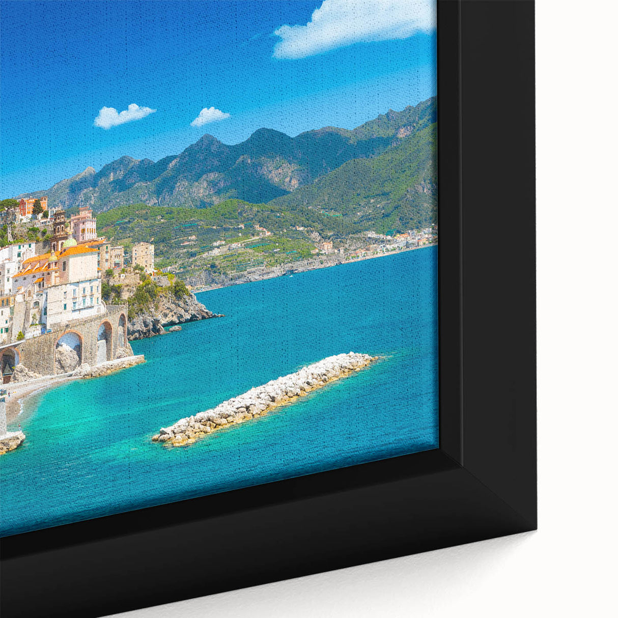 Close-up of a framed canvas depicting the Amalfi Coast in textured colors, primarily black, ideal for living room decor.
