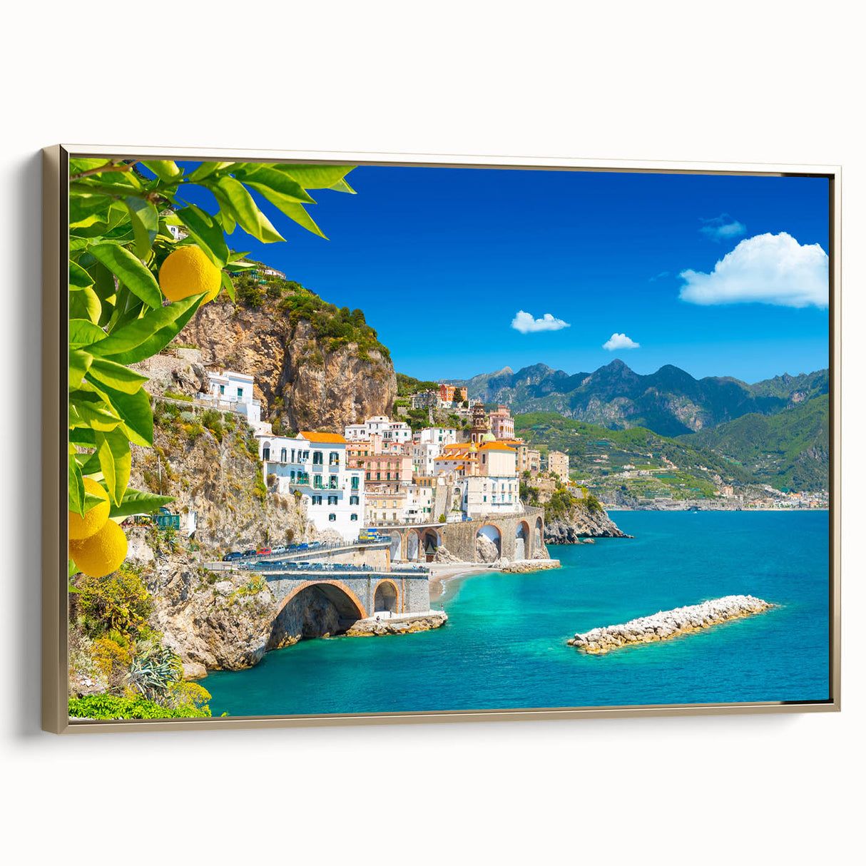 Framed canvas wall art depicting the Amalfi Coast in muted gold and black tones, suitable for bedroom decor.