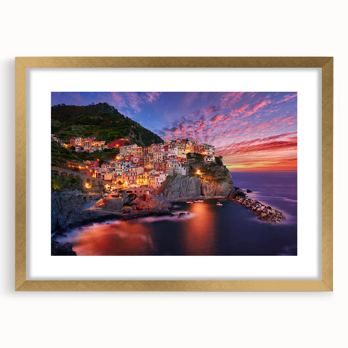 Abstract art print of Cinque Terre with vibrant hues, in a gold frame, ideal for bedroom or dining room decor.