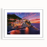 Textured art of Cinque Terre with abstract prints in vibrant hues on a white framed mat, ideal for bedroom art.
