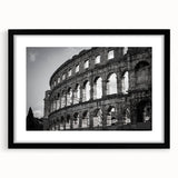 Extra large framed print of a colorful abstract rendition of the Colosseum in Italy, ideal for living room decor.
