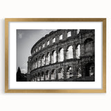 Abstract art print of the Colosseum in muted earth tones on a framed canvas, ideal for dining room decor.