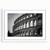 Textured art print of the Colosseum in muted earth tones on a white framed mat, ideal for bedroom art.