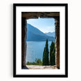 Extra large abstract art print of Lake Como with vibrant colors on a textured canvas, framed in black.