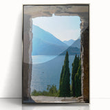 Framed acrylic print of Lake Como with lush greenery and tranquil water, in mid-century modernist style.
