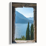 Vintage poster art of Lake Como with colorful imagery on a large framed canvas, ideal for living room decor.