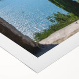 Art deco poster of Lake Como with muted blue and green tones on rolled canvas, suitable for dining room wall art.