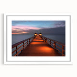 Textured abstract art print depicting a European cityscape in muted earth tones, framed with a white mat.